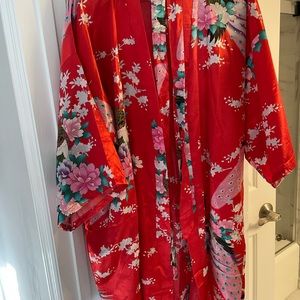 Chinese red robe peacock design